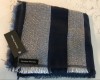 : black and white scarf with black colored tag with logo Handsel Monday attached to scarf