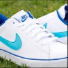 turquoise blue Nike check logo on white sneaker, dark blue word “Nike” and dark blue Nike check under “Nike” wording on tongue of shoe