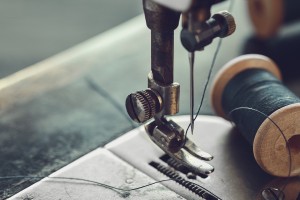 Close up of sewing machine with needle and thread