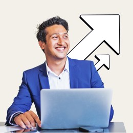 A man sits in front of a laptop and smiles while looking to the side. A graphic of arrows pointing up and to the right is also shown.
